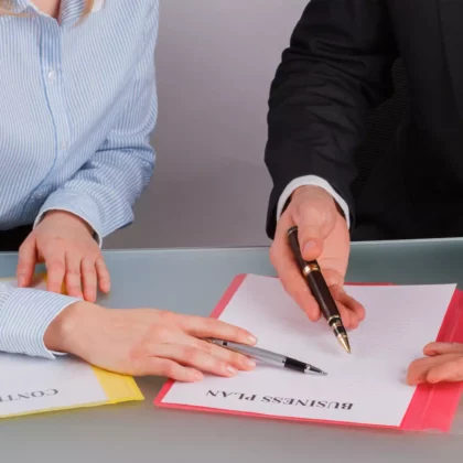 businessman-and-businesswoman-working-with-document