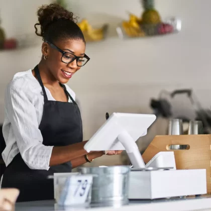 friendly-african-american-shop-assistant-using-pos